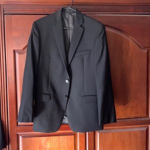 Calvin Klein slim fit black suit. Size 38R pants 33w x 32L